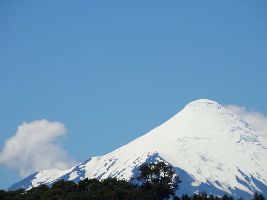 From Puerto Varas: Osorno Volcano & Petrohue Falls Day Tour - Ensenada begins the climb toward Osorno