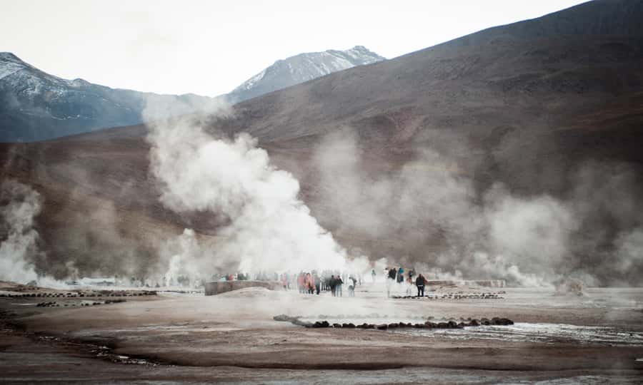 From San Pedro de Atacama: Tatio Geysers and Machuca Tour - Walking the geyser field at sunrise
