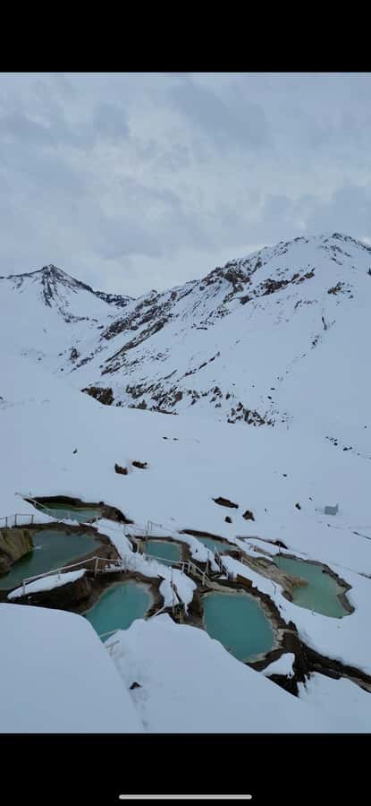 Full-Day Embalse del Yeso & Hot Springs Tour from Santiago - Chilean cheese and wine with a mountain view