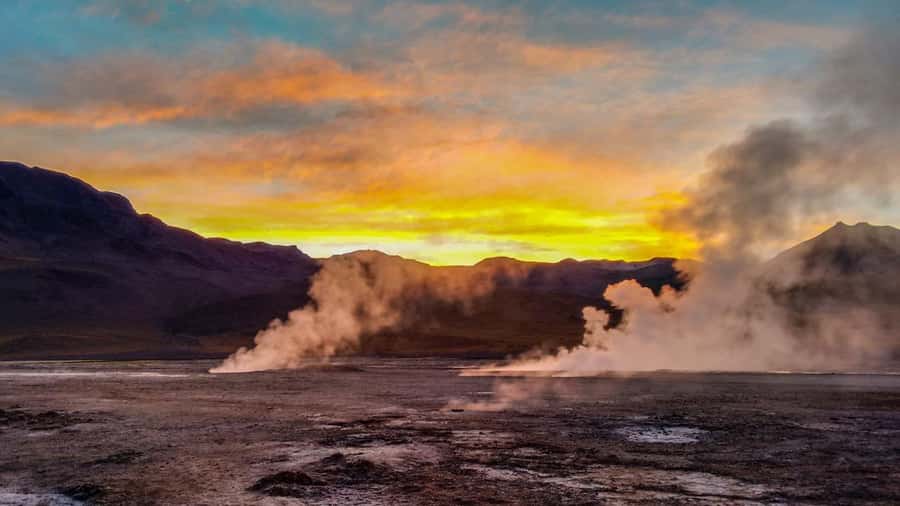 San Pedro de Atacama: El Tatio Geysers & Machuca Lagoon Trip - Walking among the El Tatio craters